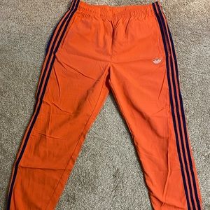 Orange Adidas track pants